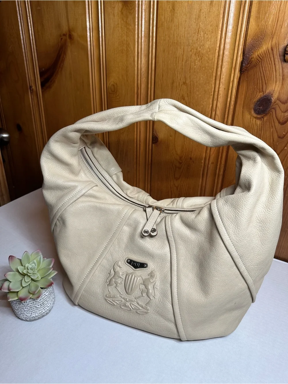 Cream Leather Shoulder Hobo Bag with Embossed Crest